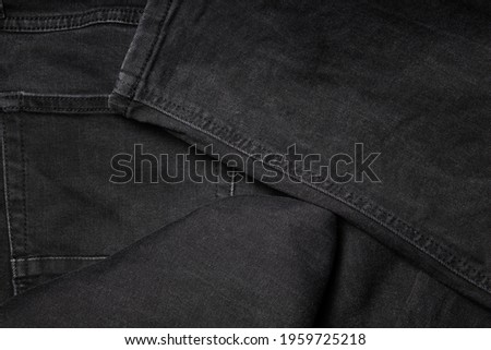 Brand new black jeans textile. Jeans macro texture background