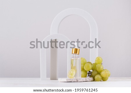 Skin care. Serum with grape seed extract on the background of arches. Copy space