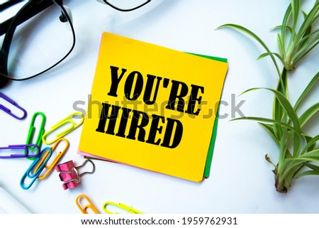 Text sign showing You're Hired