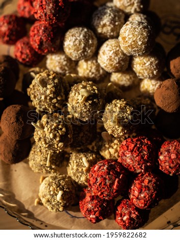 Chocolate Candies and Handmade Truffles Pistachios, hazelnuts, dried fruits, coconut, chocolate. Fitness sweets. Useful candy.