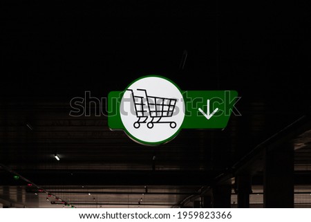 A shopping cart sign in the supermarket parking lot. Cart sign close-up
