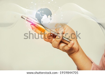 The hand of a business woman uses a smartphone to connect to global network communication, searching for information with modern technology : Social networking
concept Royalty-Free Stock Photo #1959844705