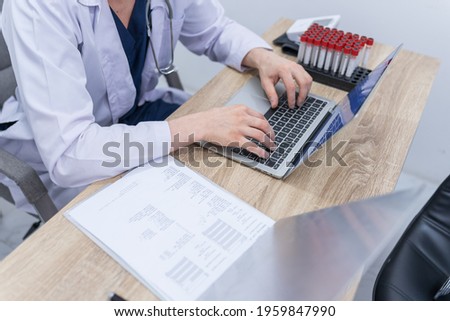 Close up hands of doctor medical staff typing report on computer laptop modern technology in hospital clinic. Physician make appointment working online to consult and diagnose patient with illness.