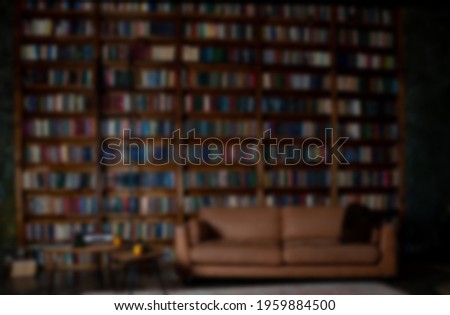 Book background. Selective focus. Blurred texture of old books. Bookshelves in the library.