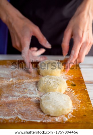 cheesecake and with beautiful delicate women's hands, cottage cheese pancakes with flour