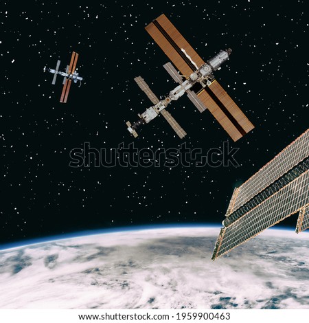 Different spaceships above  the earth globe. The elements of this image furnished by NASA.

