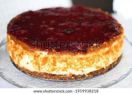 cheesecake with red berries and a biscuit base