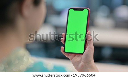 Indian Woman using Smartphone with Chroma Key Screen 