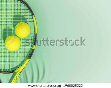 Tennis. Spring sport composition with yellow tennis ball and racket on a green background of tennis court with copy space. Sport and healthy lifestyle. The concept of outdoor game sports. Flat lay Royalty-Free Stock Photo #1960025323