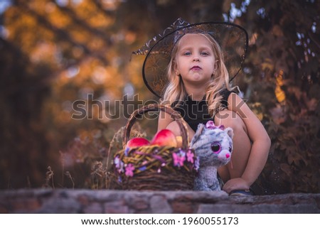 Little sorceress girl in the fairy forest