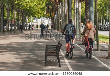 People on streets living and doing normal live in city biking sitting and walking on pedestrian way Royalty-Free Stock Photo #1960084048