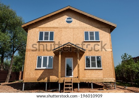 New house built from panels on blue sky background