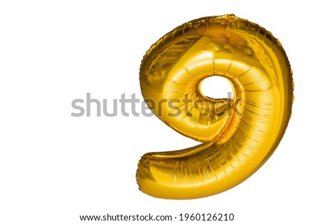 Close up view of balloon in form of number nine isolated on white background. 