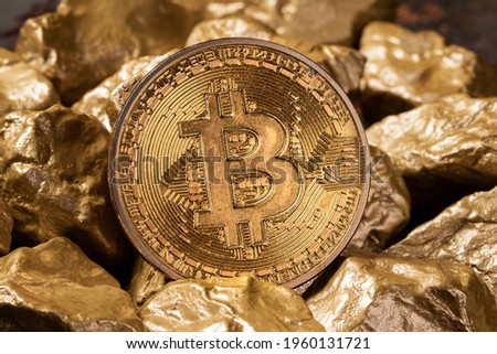 Bitcoin cryptocurrency with gold nuggets. Investment and store of value concept.