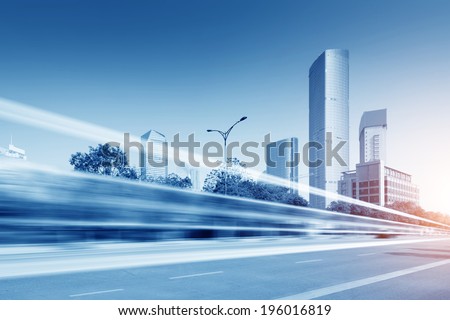 the light trails on the modern building background in shanghai china. 