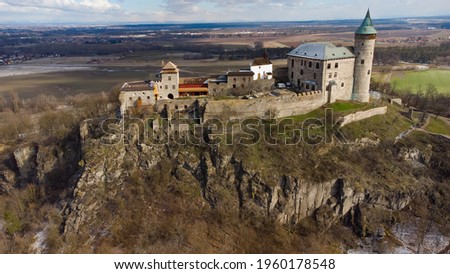 Picture of a beautiful medieval renovated castle Kunětická hora situated on an extinct volcano near the city of Pardubice in Czech Republic. The castle on a hill is surrounded by lowlands of Labe.