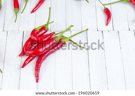 red hot chili peppers on white wooden