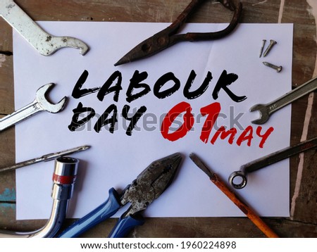 01 May Day celebration Happy Labour Day Banner with Tools in background on concept of industry , employment for nation.