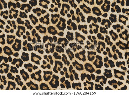 Leopard seamless pattern. Leopard spots. fabric texture closeup Royalty-Free Stock Photo #1960284169