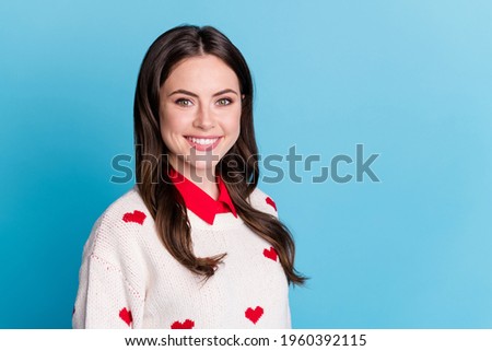 Photo of shiny lovely young lady wear hearts print sweater smiling isolated blue color background