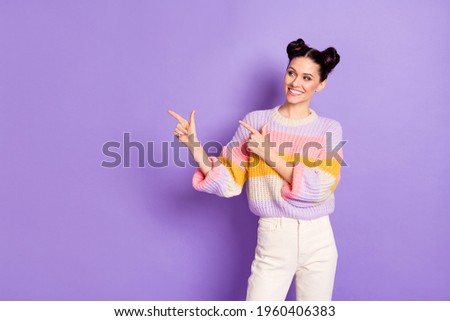 Portrait of charming cheerful girl demonstrating copy empty blank space solution ad isolated on bright violet purple color background