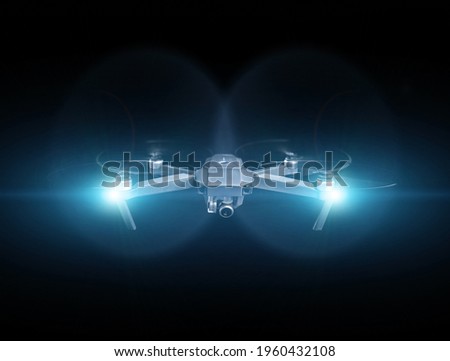 Drone spy. Drone - Flying in the dark, on black background. Closeup on dark. Portable drones, View on the drones gimbal and camera. Royalty-Free Stock Photo #1960432108