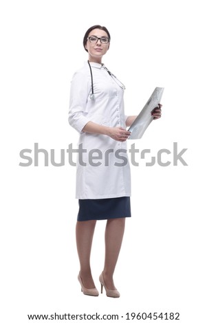 in full growth. woman doctor with an x-ray in her hands.