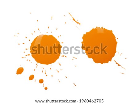 Orange paint splashes on white background, top view