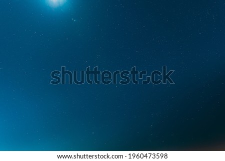 Night Starry Sky Galaxy With Glowing Stars. Bright Glow Of Sky Stars Natural Background Backdrop In Blue Colors. Copyspace.