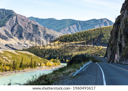 Beautiful summer landscape. Mountain road, river and forests