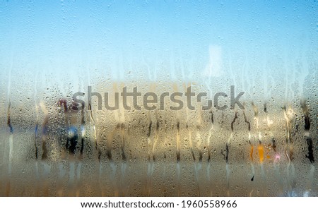 Water drops on misted glass as an abstract background.