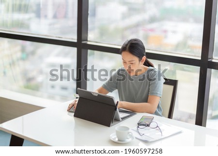 Businesswoman working on a laptop in office