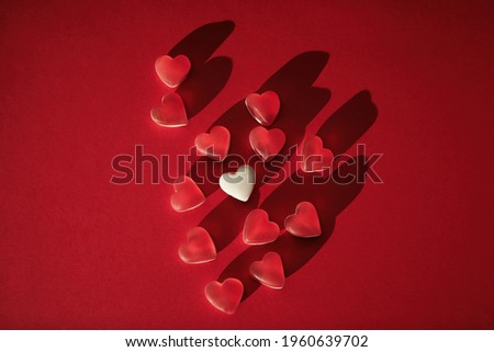 Top view of sweet candies love shape, mock up red heart. Valentine day concept.