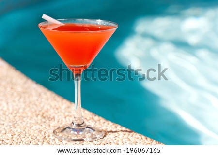 Cocktail Margarita with ice near swimming pool, nobody