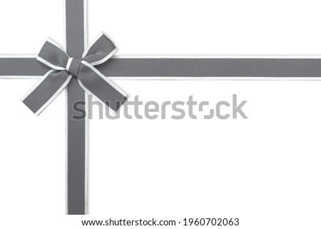 Clipping path. Top view(Flay lay) of ribbon isolated on Gift box and Straight line on white scene view. Wedding Party decorate. Gray Ribbon. 