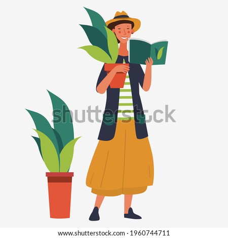 Happy young woman reading book and holding flower pot. Woman planting gardens flowers. Agriculture gardener hobby