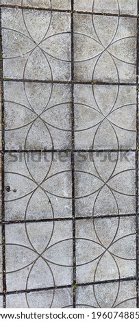 View of the gray paving slabs with patterns. Rounded lines Background