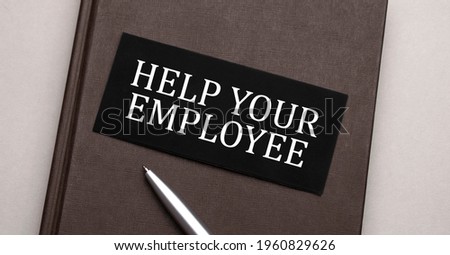 help your employee sign written on the black sticker on the brown notepad. Tax concept