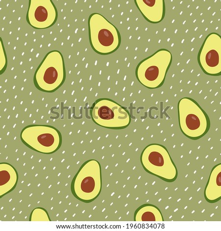 Seamless pattern with avocado on green dotted background. Hand drawn texture for textile, print, packaging.