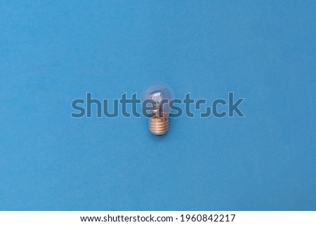 tungsten bulb on blue background concept idea thinking startup business