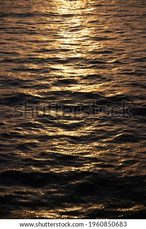 Texture background with sea water on the Sunset