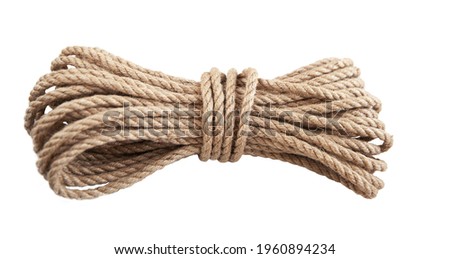 Rope made of natural jute on a white wooden background. Products made of natural materials. Royalty-Free Stock Photo #1960894234