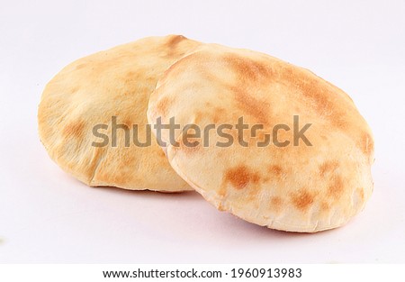 small arabic lebnani bread isolated on white background Royalty-Free Stock Photo #1960913983