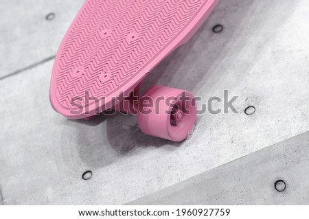 Pink skateboard. Disassembled in the training ground. 
Used in exercise for good health.