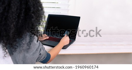 woman holding credit card, sitting at desk with laptop, technology, survey and online payment concept. copy space.