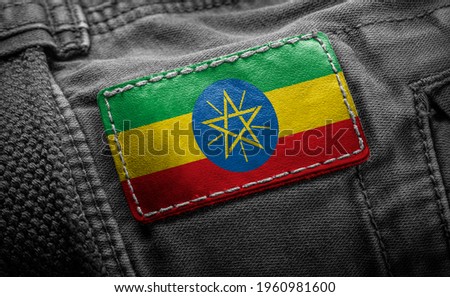 Tag on dark clothing in the form of the flag of the Ethiopia