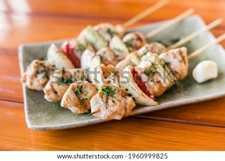 Japanese chicken grill or yakitori serve in izakaya style restourant set on Japanese style