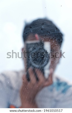 Defocused background of A person who is taking a picture in the mirror
