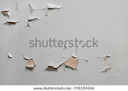 Old cracked gray paint on the wall surface Royalty-Free Stock Photo #196104266
