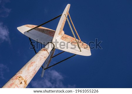 weathered shipping signal on a shore